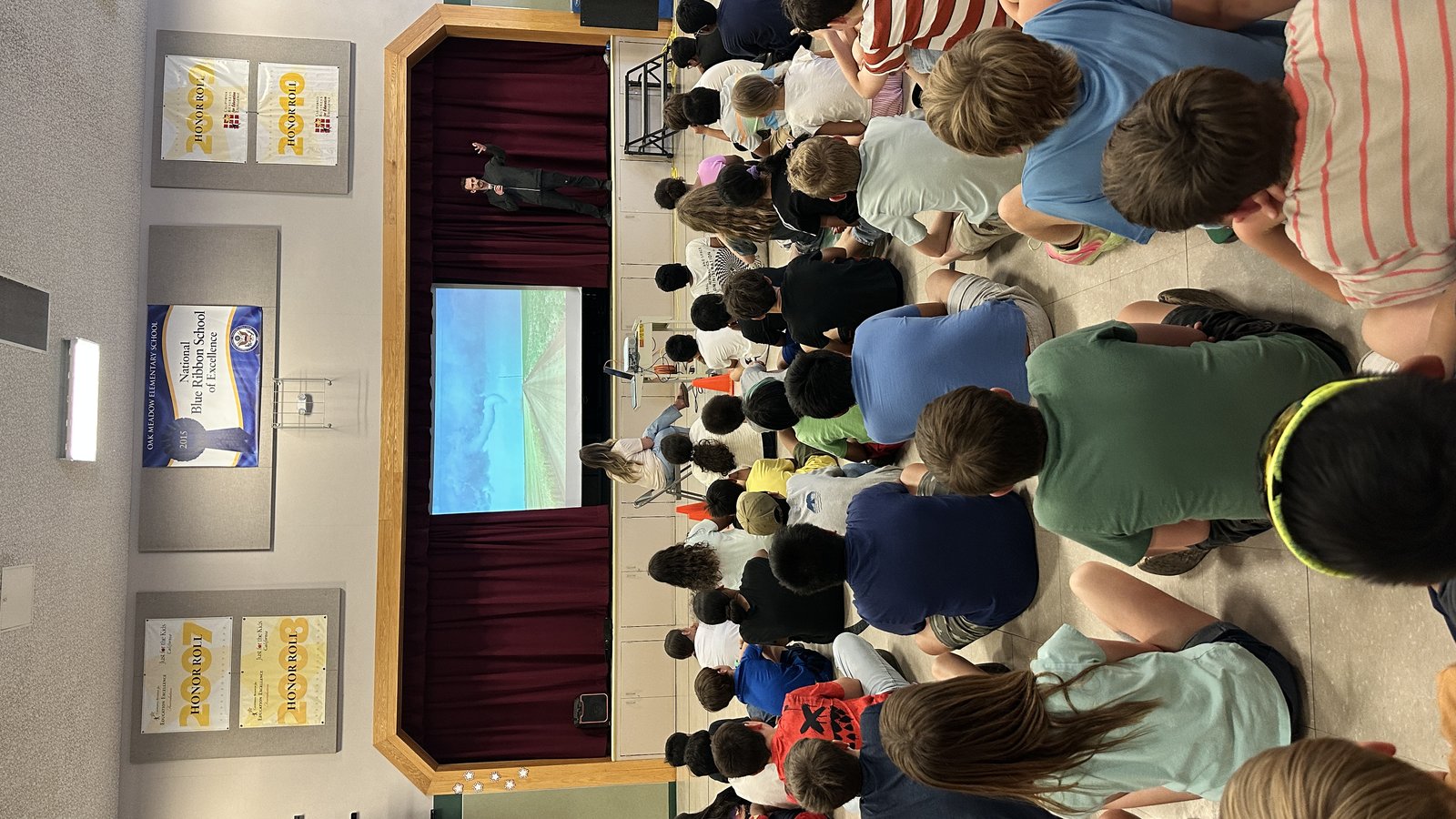 Students filling a school gym during the severe weather assembly.